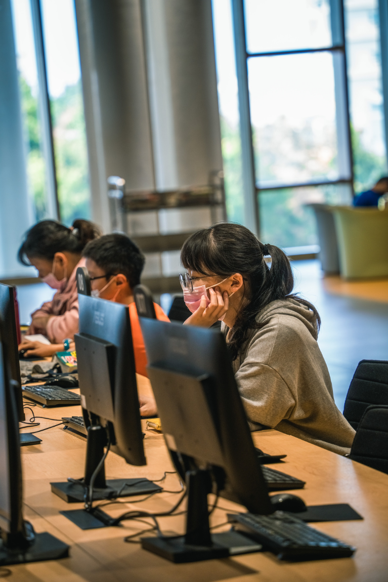 People focused at computer workstations